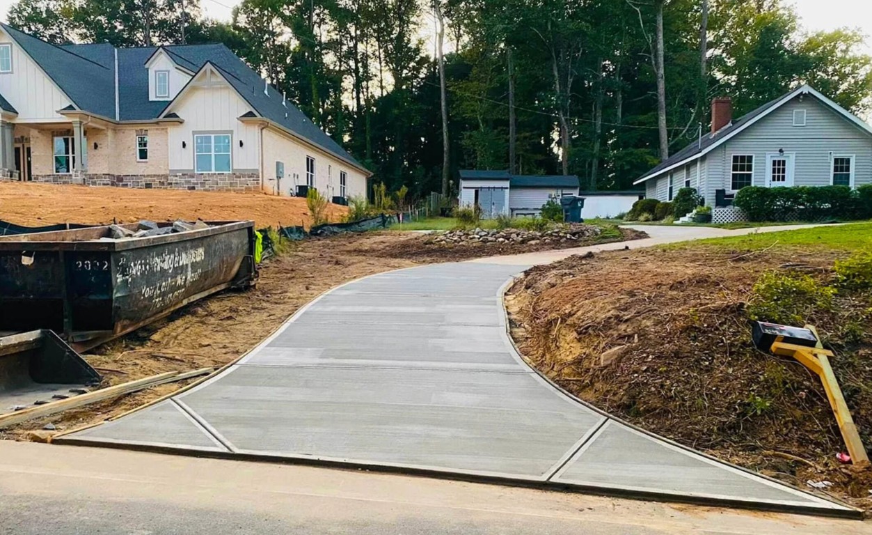 Curved concrete driveway being installed in Fond du Lac neighborhood